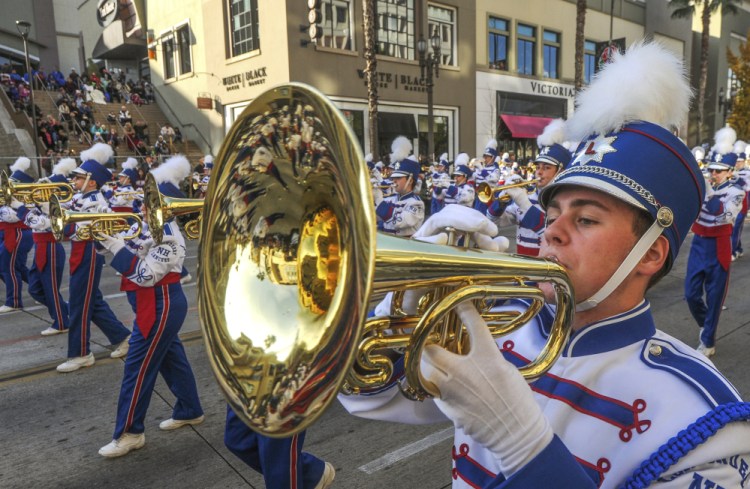 Members of the Londonderry High School Marching Lancers, from New Hampshire, perform in the 2018 Tournament of Roses Parade in Pasadena, Calif., on Monday.