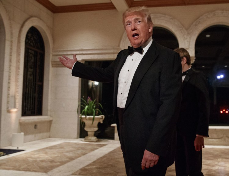 President Trump arrives for a New Year's Eve gala at his Mar-a-Lago resort in Palm Beach, Fla., Sunday. 