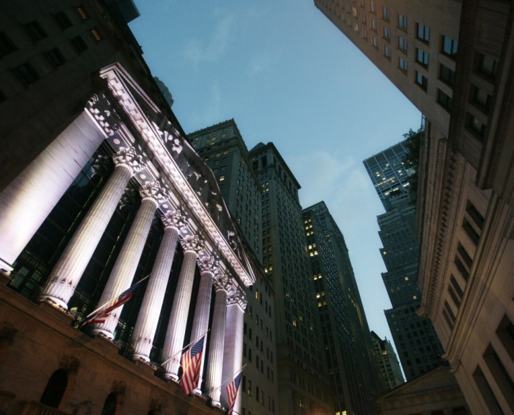 The New York Stock Exchange in 2014. The Standard & Poor's 500 index, the Dow Jones industrial average and the Nasdaq composite reached new heights Wednesday.
