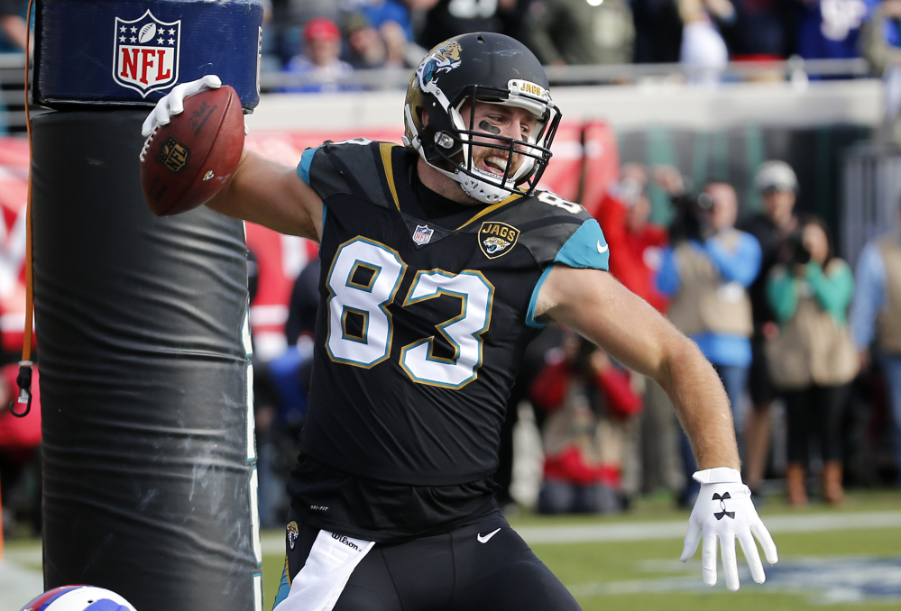 Jaguars tight end Ben Koyack spikes the ball after scoring a touchdown on a 1-yard pass in the third quarter of Jacksonsville's 10-3 win over Buffalo on Sunday in the AFC wild card game in Jacksonville, Florida.