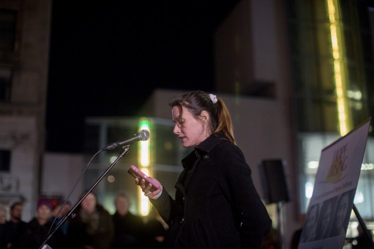 Carey Dyer tells her story of survival to the crowd during the vigil. Dyer graduated from Hope Rising about two years ago and is now the president of the Survivor Speaks USA board of directors.