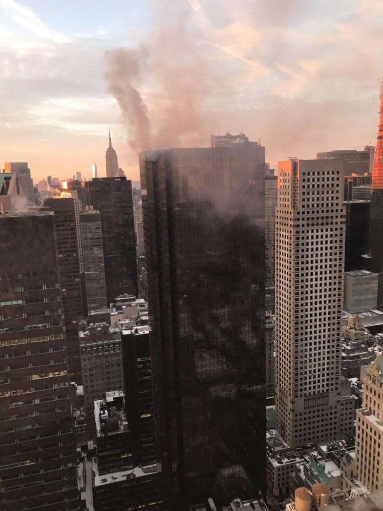 Smoke rises from Trump Tower in New York. The AP has found that stories circulating on the internet that this fire was an assassination attempt on the president are untrue.