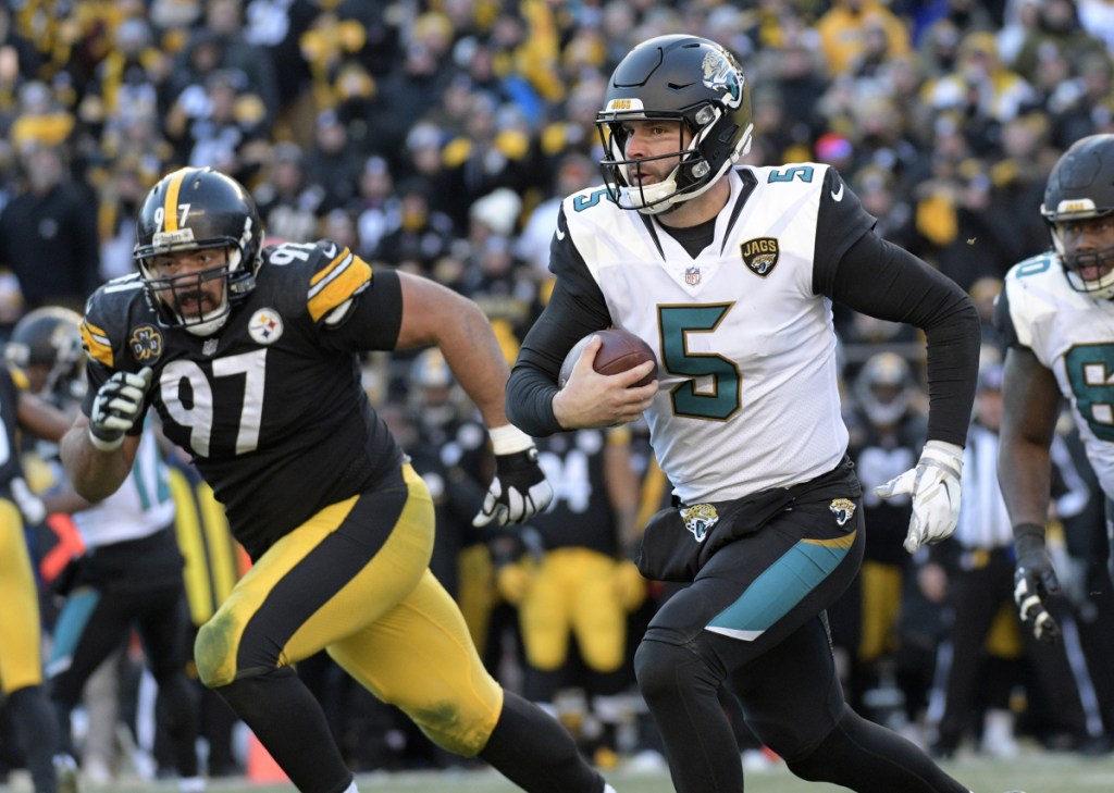 Jaguars quarterback Blake Bortles scrambles out of the pocket during Jacksonville's 45-42 win over the Pittsburgh Steelers in an AFC divisional round game Sunday in Pittsburgh. Jacksonville advance to the AFC championship game to face New England.