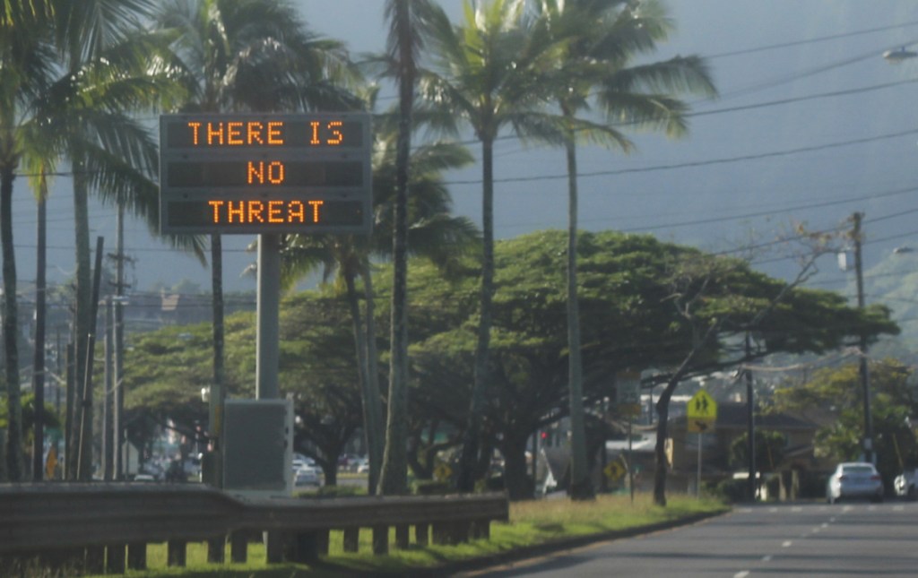 A highway median sign broadcasts a message of "There is no threat" in Kaneohe, Hawaii, on Saturday after an emergency alert warning of an imminent missile strike mistakenly went out. (Jhune Liwanag via The AP)
