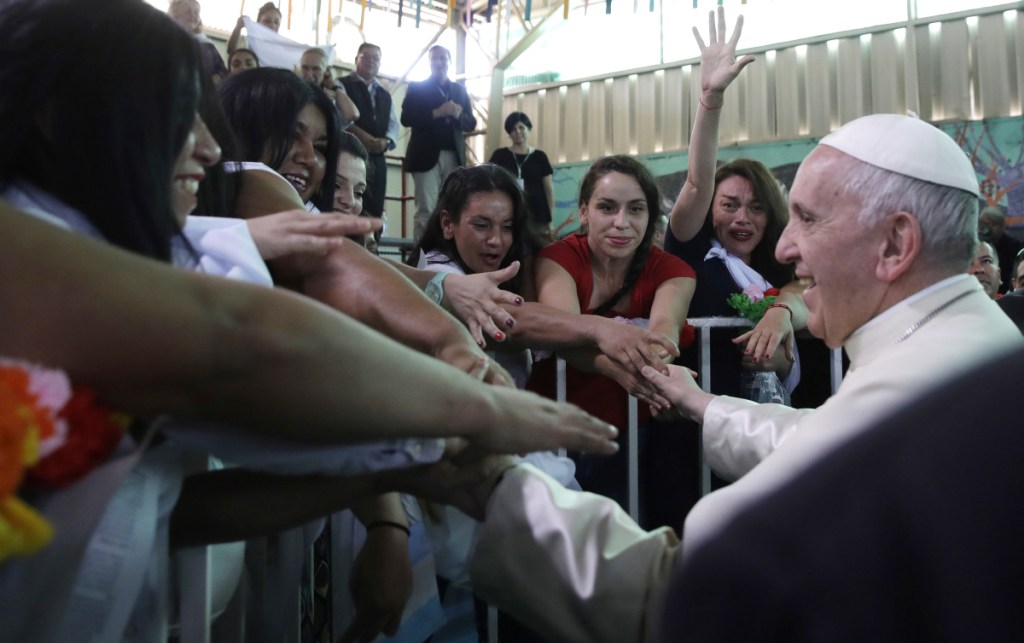 Pope Francis greets inmates at the San Joaquin women's prison in Santiago, Chile, on Tuesday.