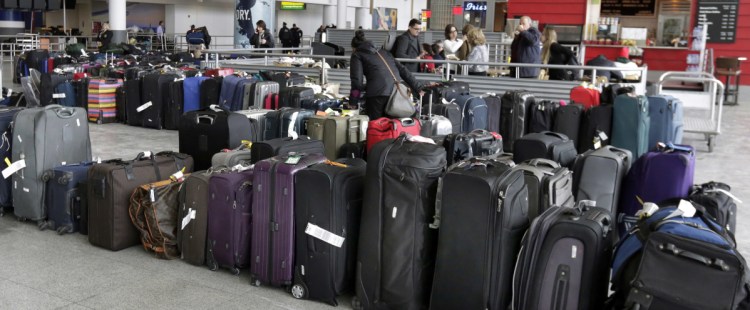 Unclaimed baggage sits at New York's John F. Kennedy Airport on Jan. 8 after a water pipe burst after days of weather-related delays in the wake of a snowstorm.