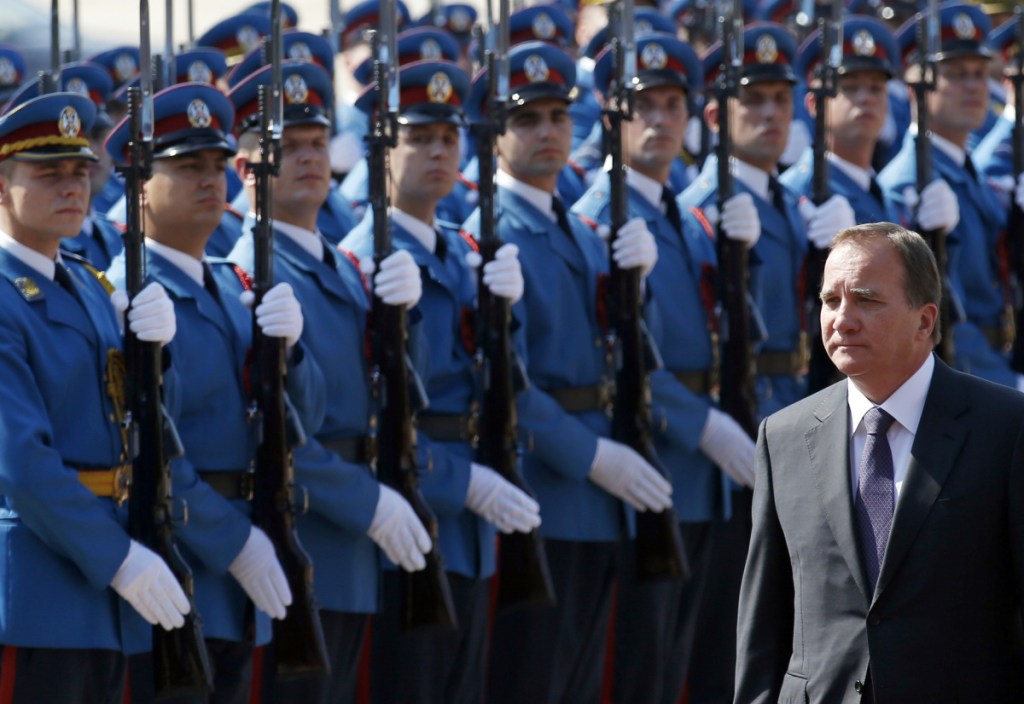 Swedish Prime Minister Stefan Lofven reviews an honor guard upon his arrival at the Serbia Palace in Belgrade, Serbia. Stories circulating on the internet about Sweden preparing for a civil war are made up.