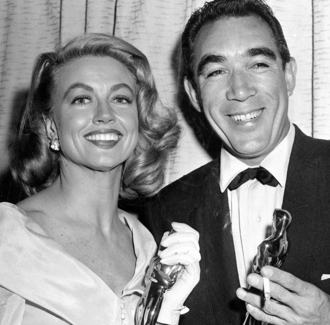 Best supporting Oscar winners Dorothy Malone and Anthony Quinn pose at the Academy Awards in Hollywood, Calif., in 1957. 