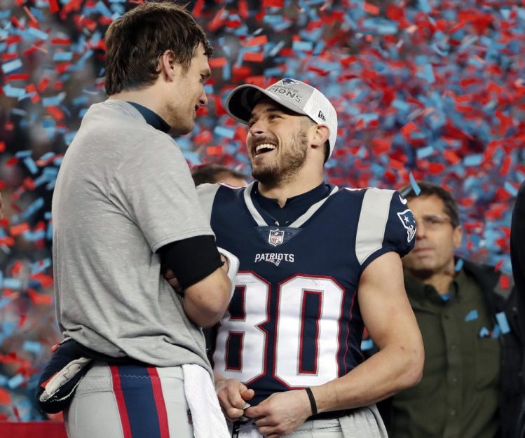 Patriots quarterback Tom Brady, left, speaks to wide receiver Danny Amendola after the game.