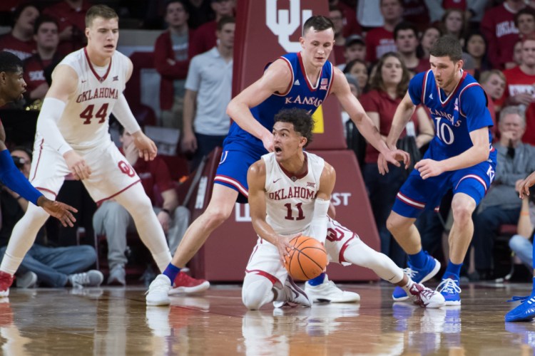 Oklahoma guard Trae Young looks for an open teammate during Tuesday's game against Kansas. Young had 16 points as the No. 12 Sooners upset the No. 5 Jayhawks, 85-80.