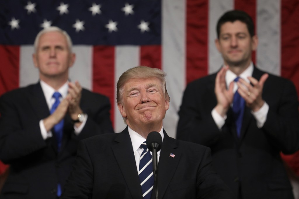 President Donald Trump. In the background are Vice President Mike Pence and House Speaker Paul Ryan of Wisconsin.