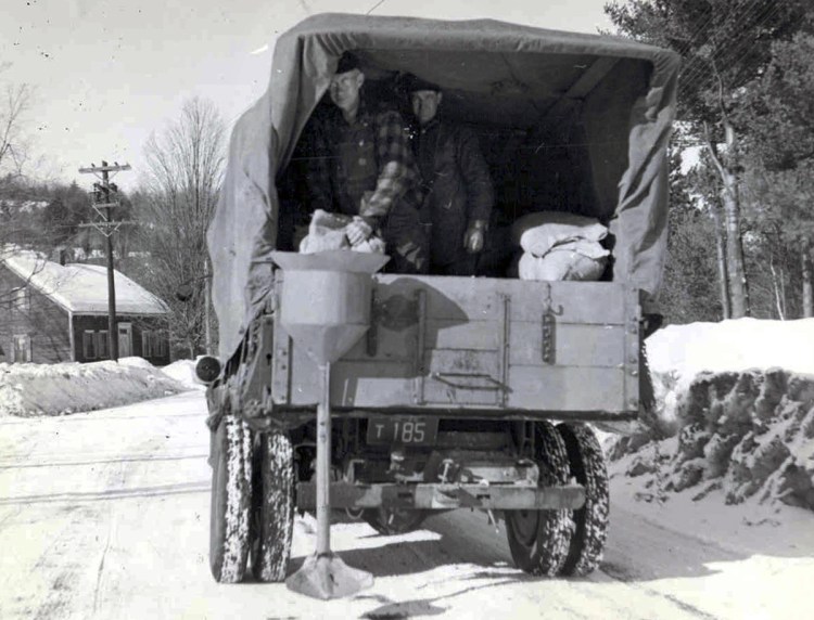 This 1940s photo shows salt being applied for de-icing on a New Hampshire road. Today, New Hampshire and Maine use a mixture that includes molasses. Research shows that rock salt corrosion harms water ecosystems.