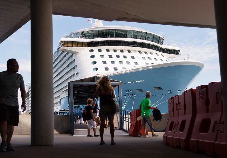 Passengers walk near Anthem of the Seas, the largest cruise ship to visit Portland in 2016. The majority of cruise ship visits to Maine occur in September and October, when many tourists want to see fall foliage.
