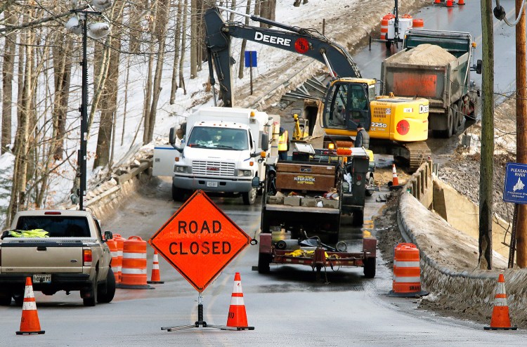 Windham Center Road was closed at the Pleasant River bridge Thursday while workers from Shaw Brothers Construction repaired a section of water main. The line broke in two places Wednesday morning. Thawing temperatures have caused water mains to break throughout the region.