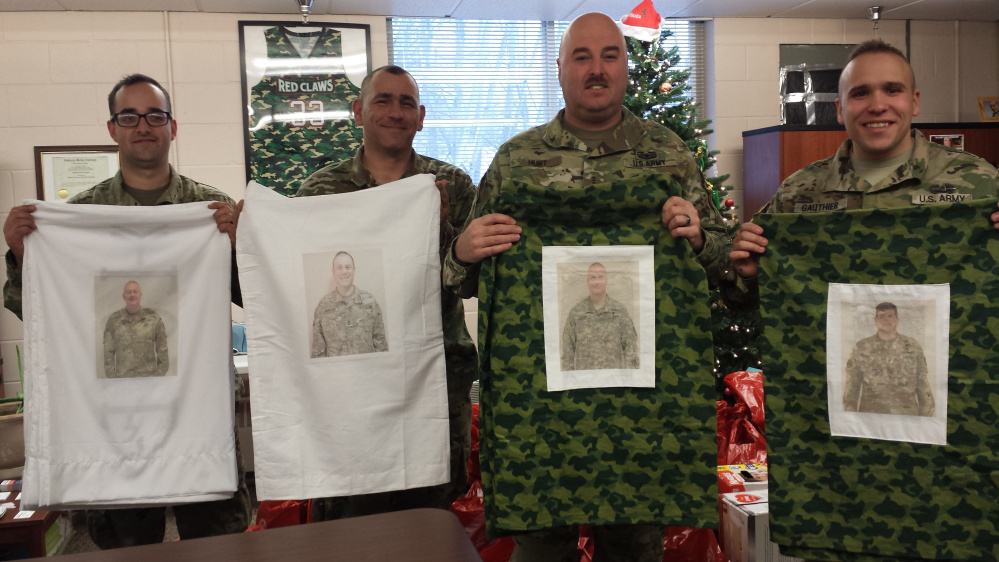 Maine National Guard members holding some of the pillowcases from left are Spc. Sean Farrell, Sgt. Ryan Gauthier, CW3 Jon Hunt and Staff Sgt. Josh Sennett.