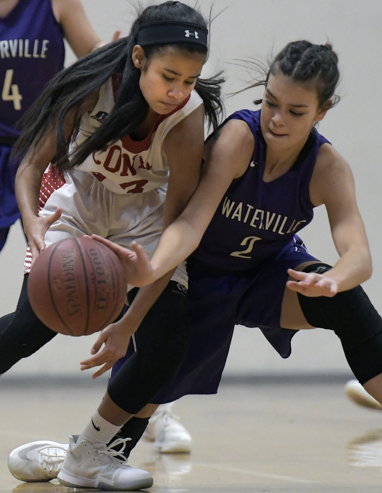 Cony sophomore Linelys Velazquez, left, is blocked by Waterville defender Paige St. Pierre during a Kennebec Valley Athletic Conference game Tuesday in Augusta.