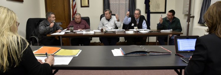 Somerset County Commissioners, from left, Cyp Johnson, Lloyd Trafton, Chairman Newell Graf Jr., Robert Sezak and Dean Cray vote during a meeting in Skowhegan on Wednesday.