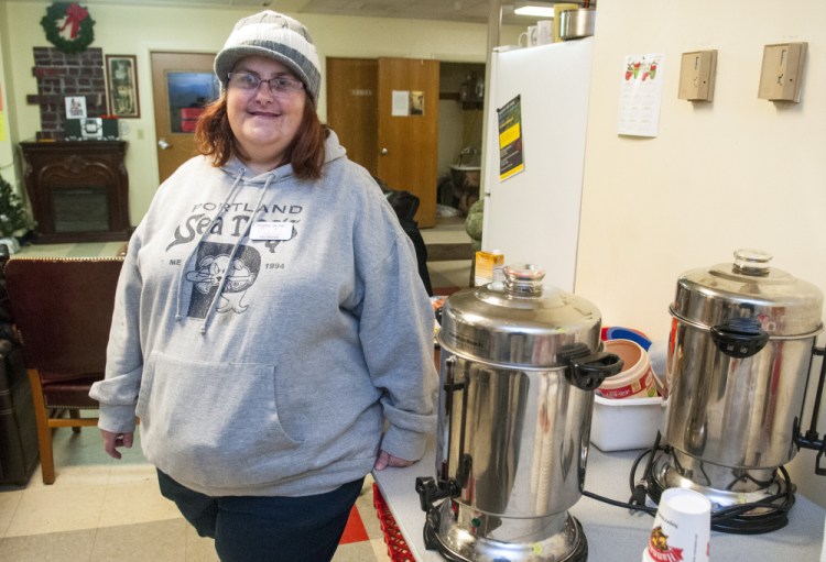 Melanie Scott stands in the coffee area Saturday in the Augusta Community Warming Center in the former St. Mark's Church parish hall on Pleasant Street in Augusta.
