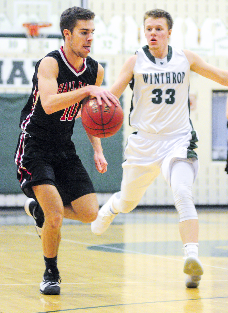 Hall-Dale's Alec Byron, left, dribbles up the court ahead of Winthrop's Nate Leblanc during a game Saturday in Winthrop.