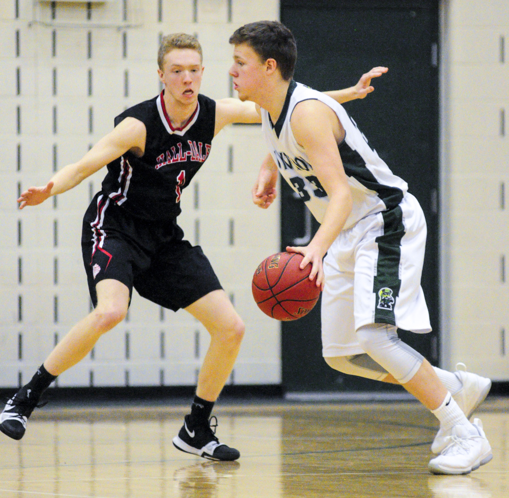 Hall-Dale's Dean Jackman, left, plays defense on Winthrop's Nate Leblanc during a game Saturday in Winthrop.