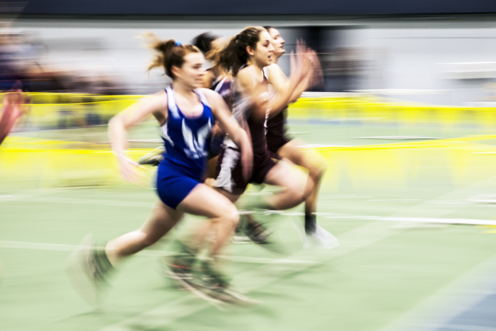 Nokomis High School's Celia Smith, center, competes in the 55 meter dash during an indoor track and field meet Friday at Colby College in Waterville.
