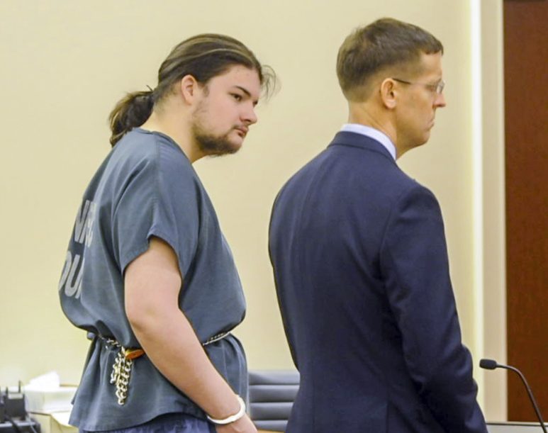 Andrew Balcer, center, stands with his attorney Walter McKee during his arraignment Friday on two murder charges and one of animal cruelty in the Capital Judicial Center in Augusta.