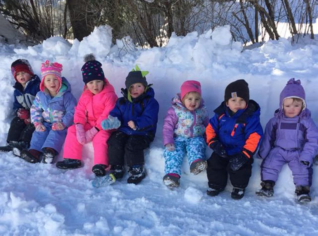 Children at Conley Connections daycare in Skowhegan sit on a snow bench. From left are Willie Tessier, Alizah Frons, Leah Haney, Zeke Jones, Emerson Thompson, Ethan Belliveau and Riley Miller.