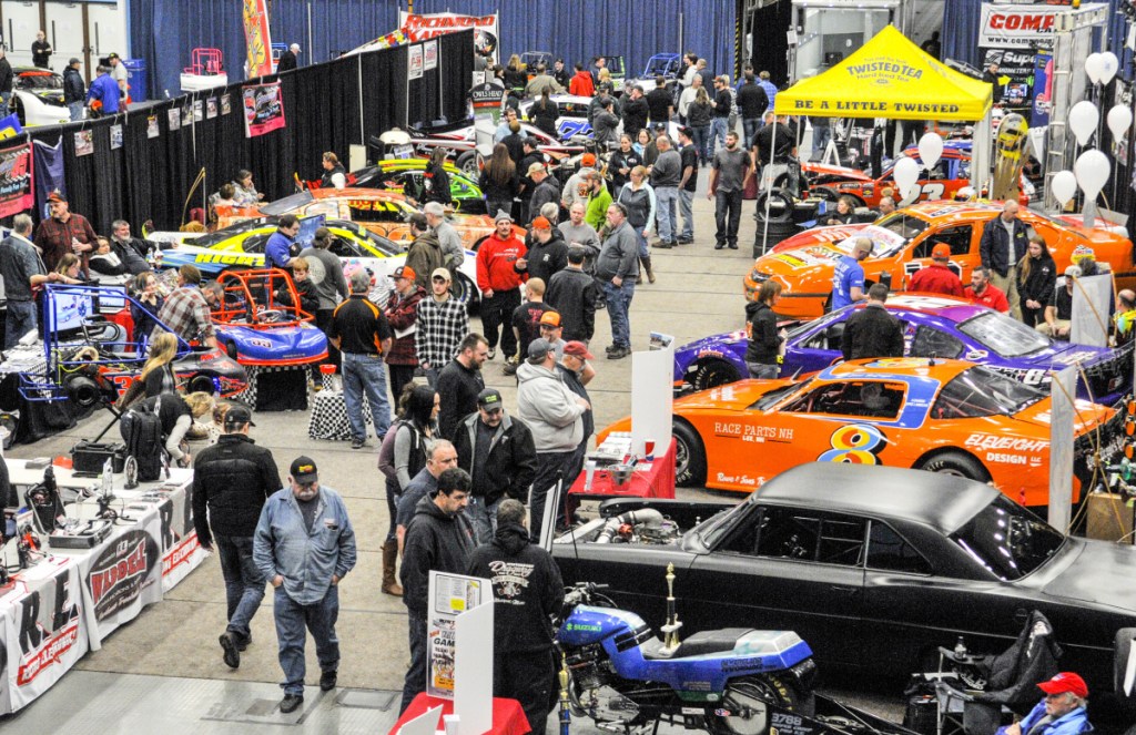 People walk past displays during the Northeast Motorsports Expo on Friday at the Augusta Civic Center.