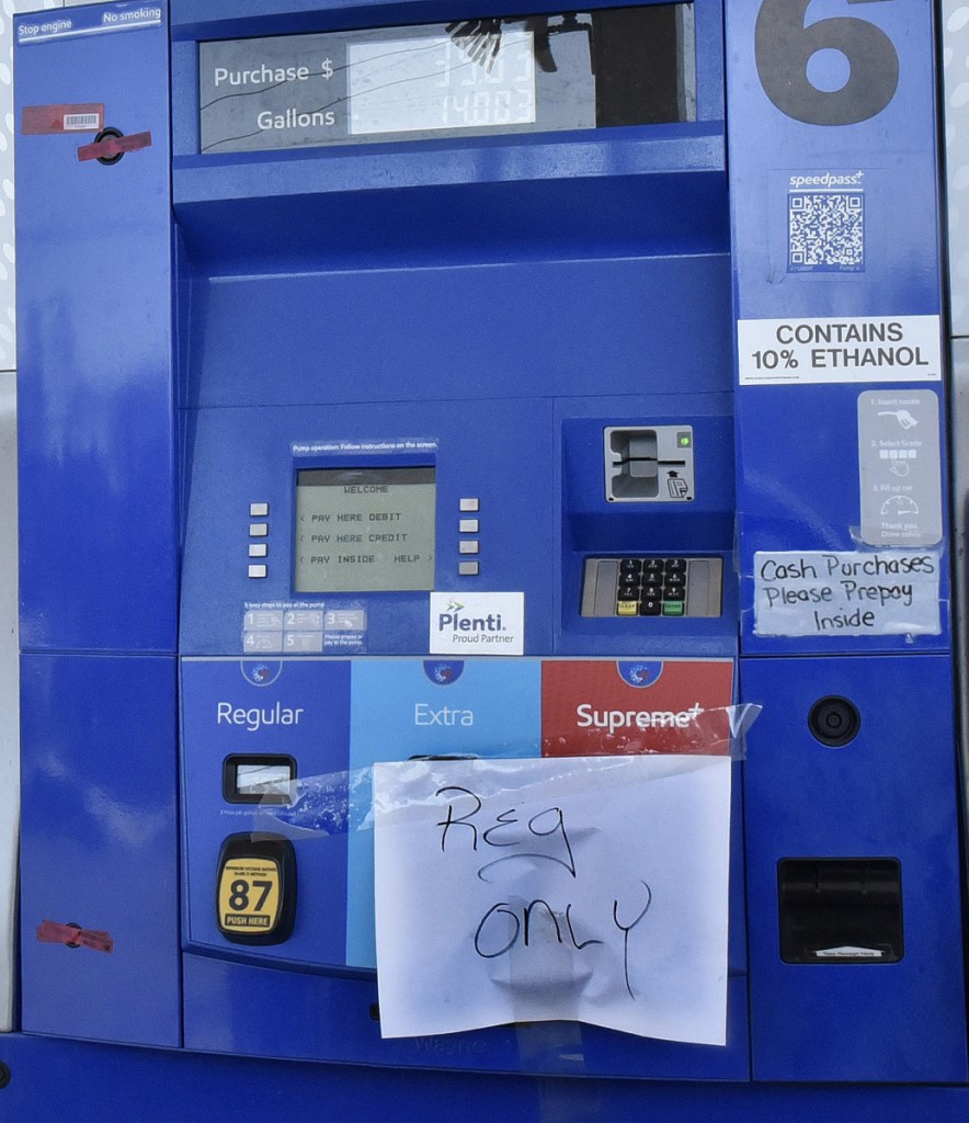 A sign saying "Reg Only" tells customers at the Mobil Mart in Waterville on Tuesday that only regular gas is available after diesel and higher octane fuels apparently got mixed up recently.