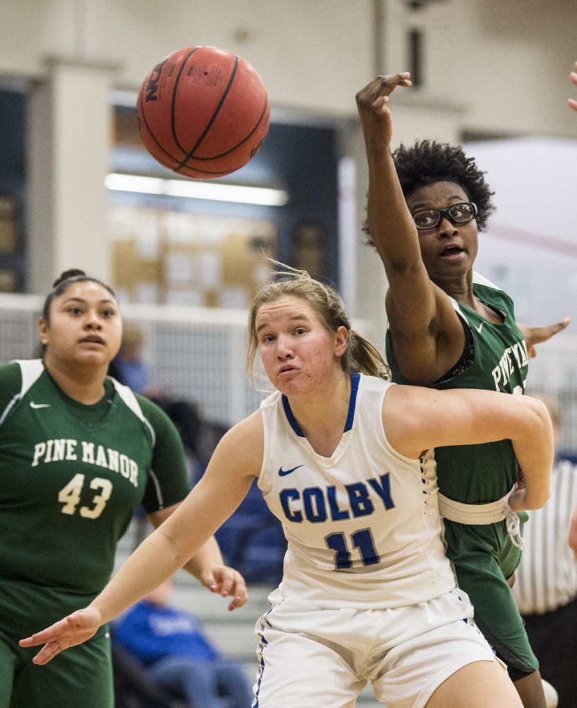 Colby College's Paige Russell (11) boxes out Pine Manor College's Nakazja Holley for the rebound Tuesday at Colby College in Waterville.