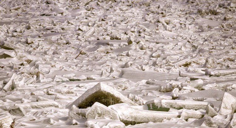 Chunks of ice are crushed together Friday in an ice jam between Farmingdale and Chelsea at Browns Island in the Kennebec River.