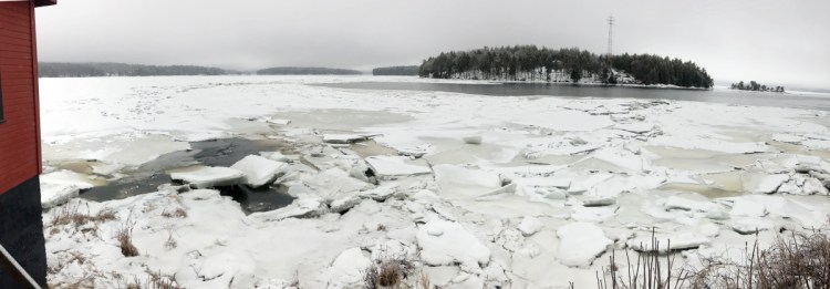 Ice chunks cling to the Kennebec River shore Tuesday at Chop Point School in Woolwich, where U.S. Coast Guard vessels are scheduled to arrive Wednesday as part of an early ice-breaking operation to ward off flooding in the Augusta area.