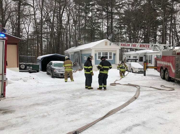 Winslow firefighters used a ladder truck Tuesday to reach the roof of a mobile home in the Pleasant Ridge Mobile Home Park on Benton Avenue in Winslow and remove a faulty smoke pipe that had started a smoky fire.