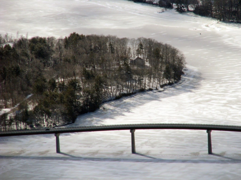 Solid ice around the Kennebec Maine Bridge is seen Wednesday with the Dresden shore at left and Swan Island at top.