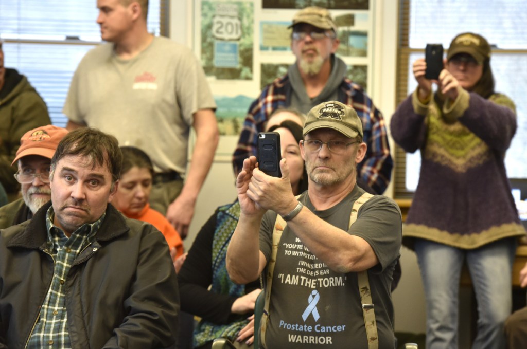 About fifty residents of Jackman crowded the Town Office in January to learn the fate of Town Manager Thomas Kawczynski. In front are Kerry Hegarty, left, and Carl Marihuber, who agreed Kawczynski should leave his position.