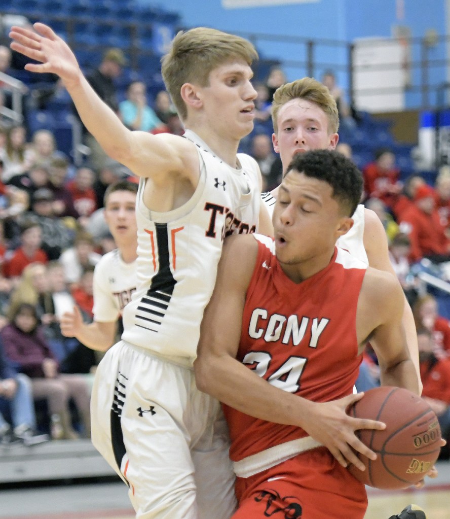 Cony senior Jordan Roddy tries to get past Gardiner's Cole Lawrence during a Kennebec Valley Athletic Conference Class A game Monday night at the Augusta Civic Center.