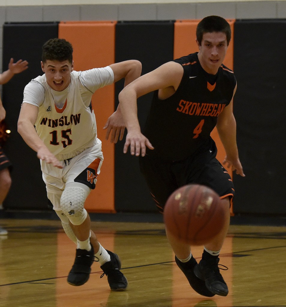 Skowhegan's Marcus Christopher, right, and Winslow's Jack Morneault scramble for a loose ball during a Kennebec Valley Athletic Conference game Tuesday in Winslow.