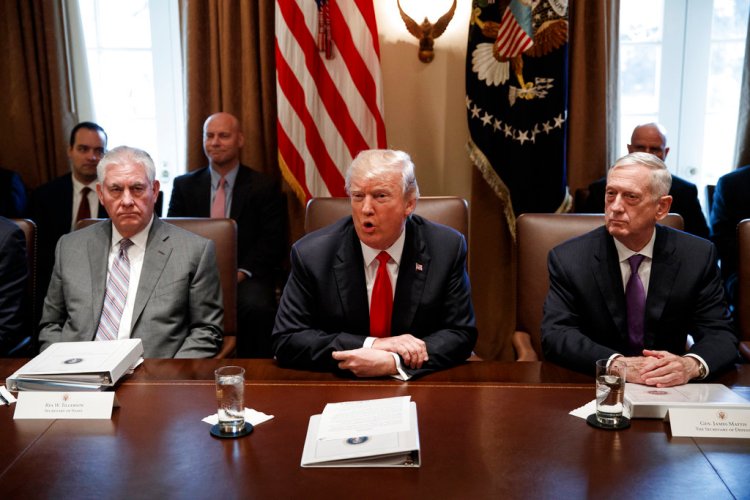 Secretary of State Rex Tillerson, left, and Secretary of Defense Jim Mattis listen as President  Trump speaks during a Cabinet meeting Wednesday.