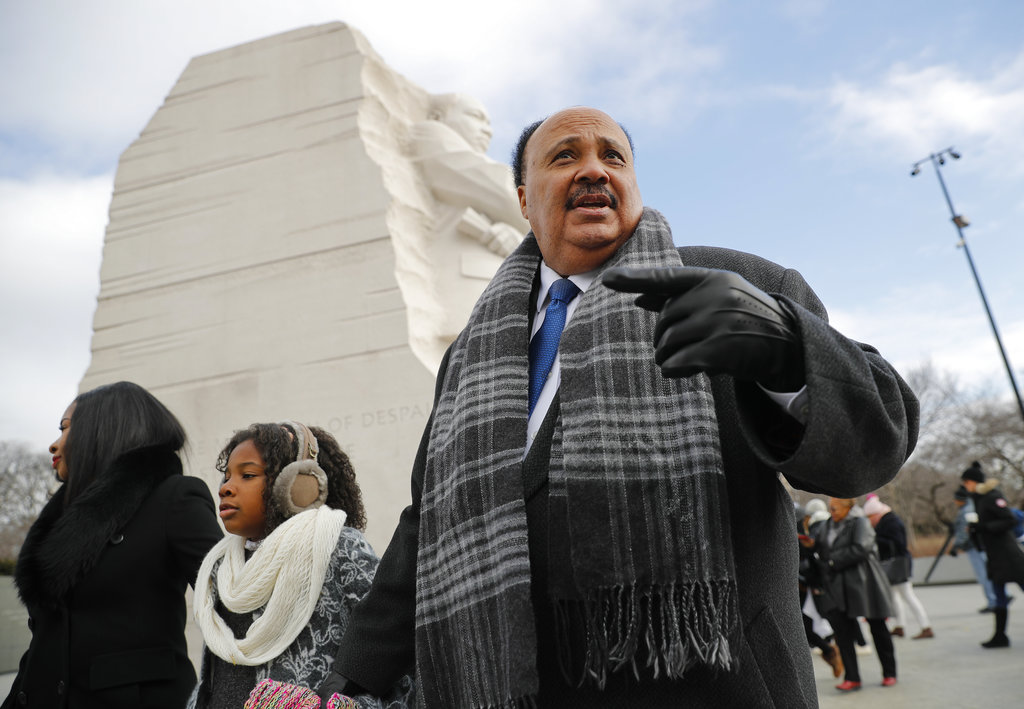 Martin Luther King III, right, with his wife Arndrea Waters, left, and their daughter Yolanda, 9, center, during their visit to the Martin Luther King Jr., Memorial on the National Mall in Washington, Monday. 