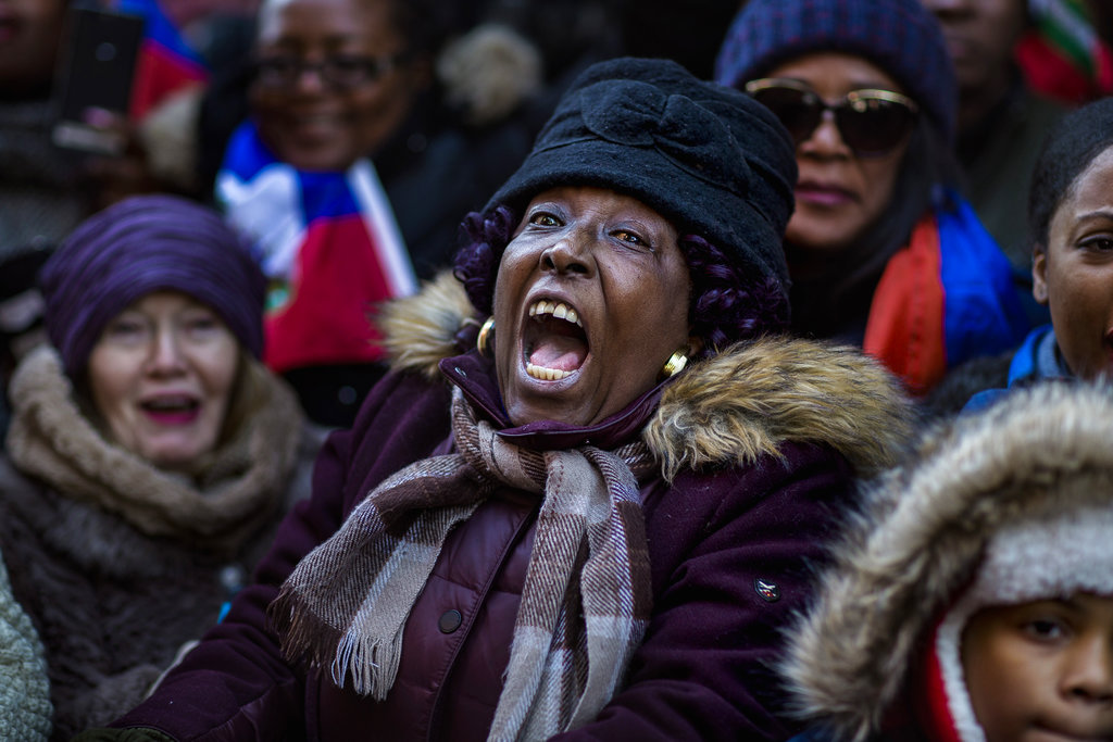 A woman shouts during a rally against racism in opposition to President Donald Trump's recent disparaging comments about Haiti and African nations in Times Square in New York, on Monday.
