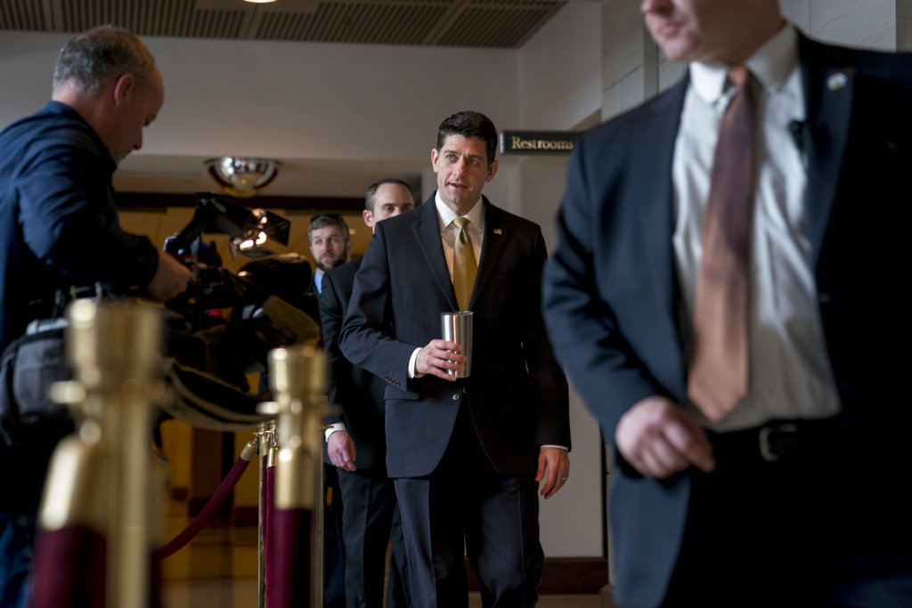 House Speaker Paul Ryan of Wis., center, walks to the Capitol Building from the Capitol Visitor's Center, Thursday,  in Washington.