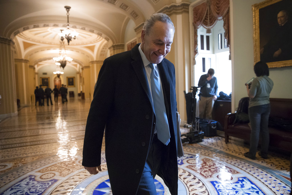Senate Minority Leader Chuck Schumer, D-N.Y., arrives at the Capitol at the start of the third day of the government shutdown, in Washington, Monday. 2018.  Schumer,  arguably the most powerful Democrat in Washington, is trying to keep his party together to force a spending bill that would include protections for young immigrants. 
