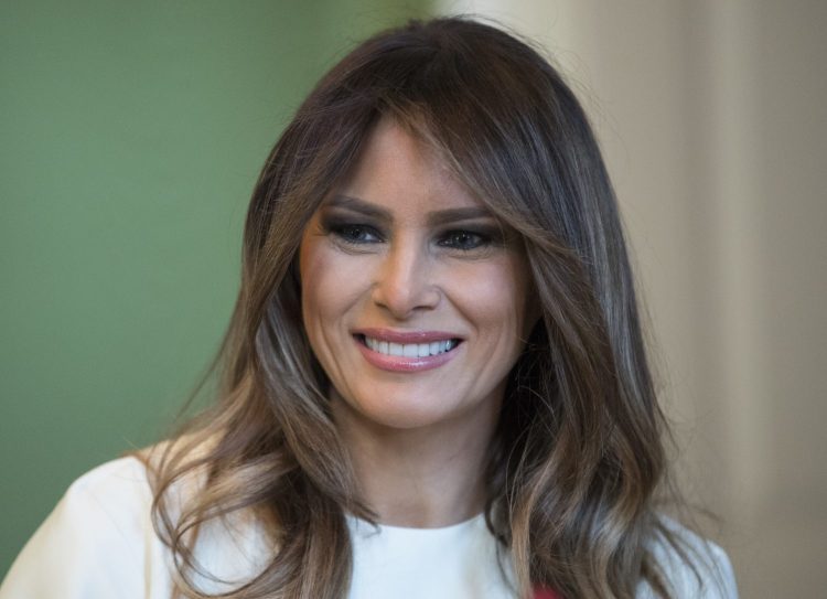 First lady Melania Trump, shown during a visit with children in November, visited the U.S Holocaust Memorial Museum in Washington, D.C., on Thursday while President Trump attended an economic forum in Davos, Switzerland, according to her spokeswoman.