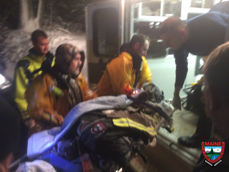 Eli Strauss is loaded into an ambulance Wednesday night after the rescue near Long Pond on Mount Desert Island.