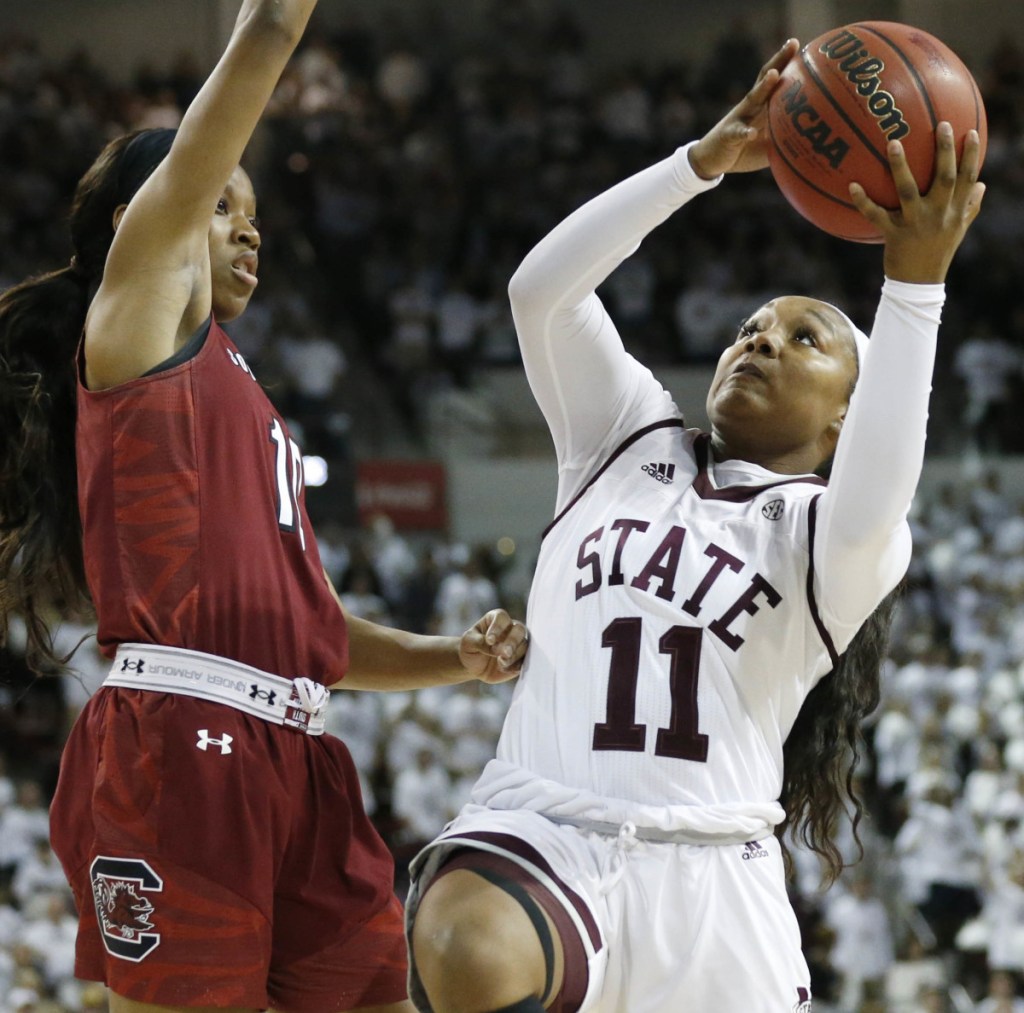 Roshunda Johnson of Mississippi State heads to the basket Monday night while guarded by Bianca Jackson of South Carolina during the first half. Mississippi State won, 67-53.