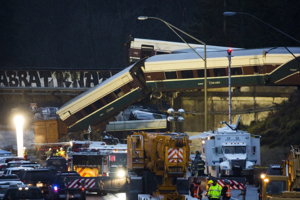 Amtrak train cars lie on Interstate 5 after a derailment in DuPont, Washington, on Dec. 18, 2017. The crash occurred when an engineer failed to slow down for a curve, killing three people. Positive Train Control would have sensed where the train was and automatically slowed before it reached the curve.