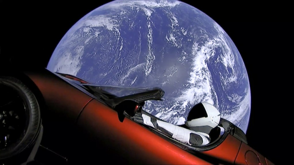 This image from video provided by SpaceX shows the company's spacesuit in Elon Musk's red Tesla sports car that was launched into space during the first test flight of the Falcon Heavy rocket on Tuesday.