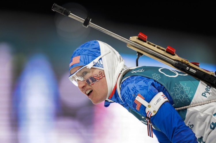 Clare Egan looks at her time after crossing the finish line during the women's 7.5km biathlon sprint at the 2018 Winter Olympics in PyeongChang, South Korea on Saturday.