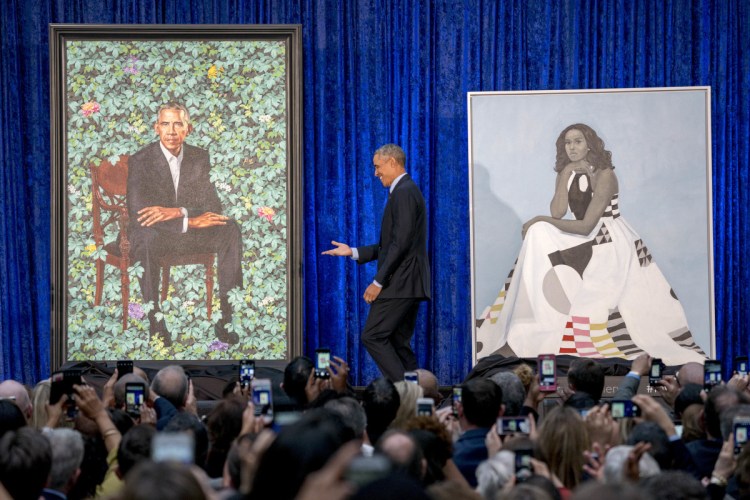 Former President Barack Obama stands on stage during the unveiling of the official Obama portraits at the Smithsonian's National Portrait Gallery on Monday in Washington.