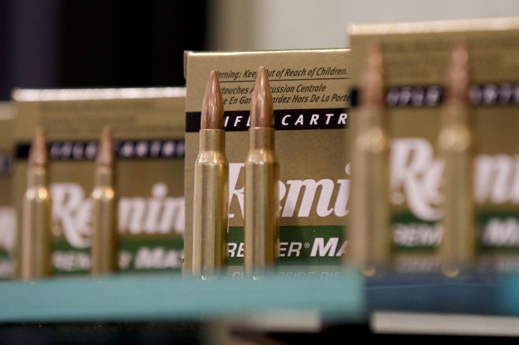 Remington rifle cartridges are displayed at the 35th annual SHOT Show in Las Vegas. Remington, the gunmaker beset by falling sales and lawsuits tied to the Sandy Hook Elementary School massacre, is filing for bankruptcy.